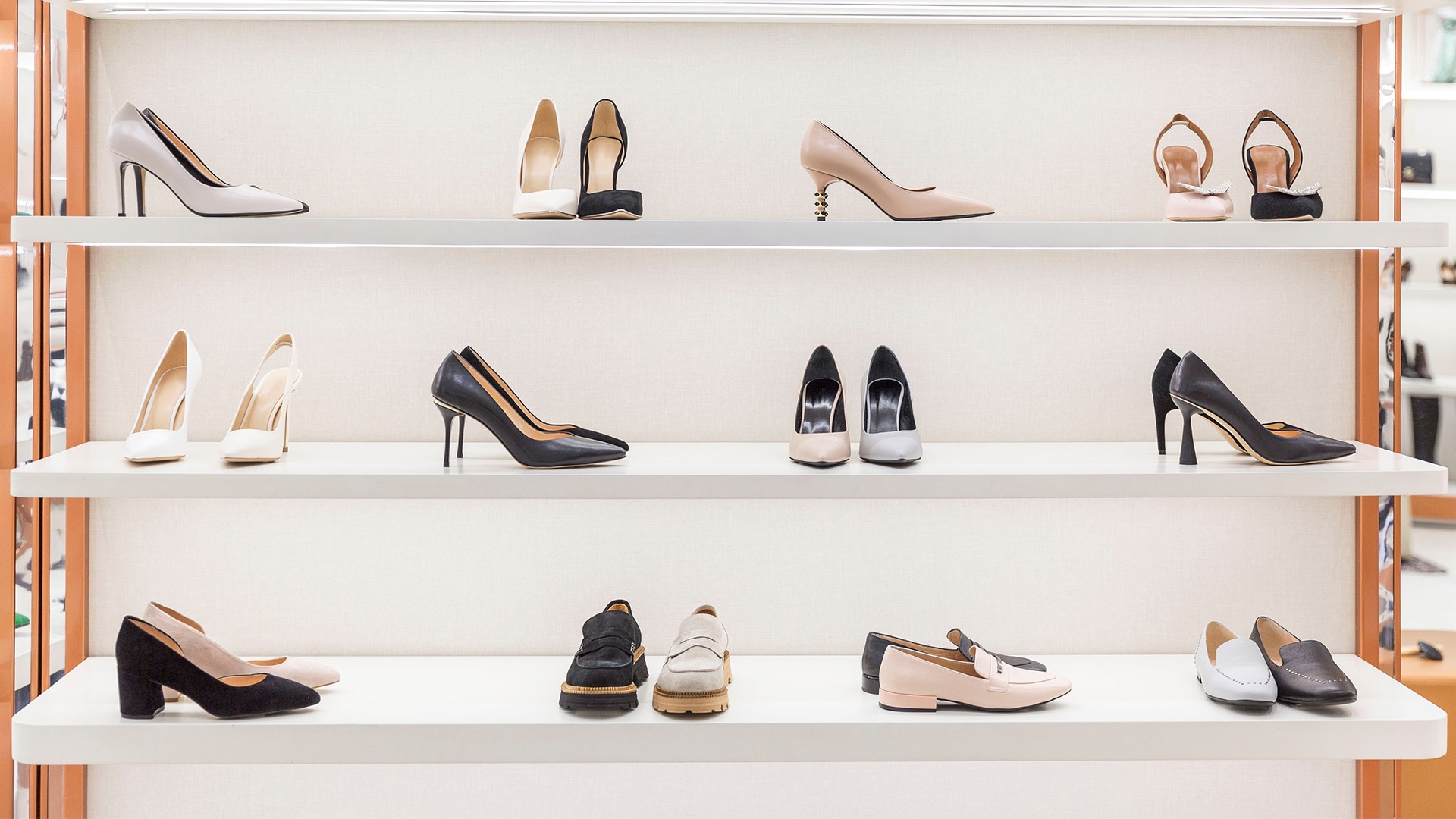 Variety of women heels from a luxury shoe brand in Singapore, arranged on a shelf for display