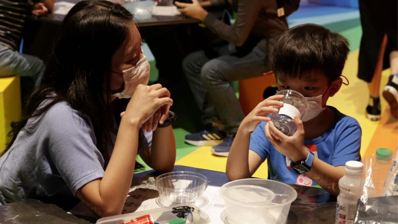 Mother and son enjoying their time at the holiday programme at ArtScience Museum, Singapore