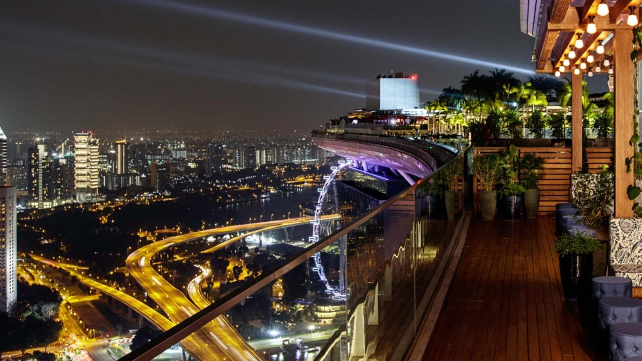 Night view of Singapore from a rooftop bar and restaurant at Marina Bay Sands